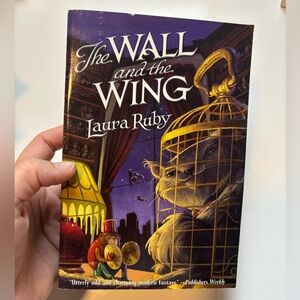 The Wall and the wing paperback book by Laura Ruby